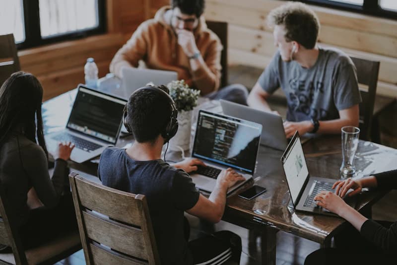 Corporate and technical staffing professionals collaborating at modern workstation